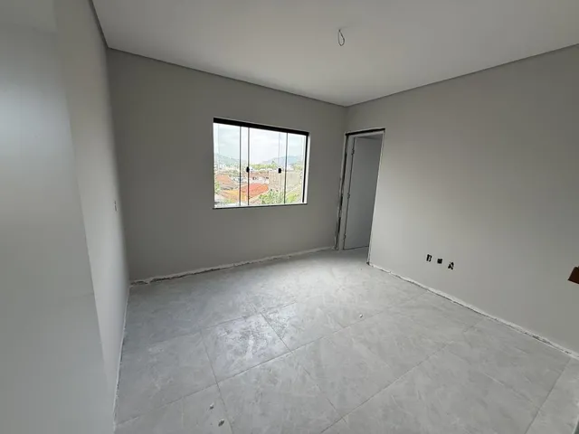 Imagem 6: Apartamento de dois dormitórios, sendo uma suíte, sacada com churrasqueira e uma vaga
