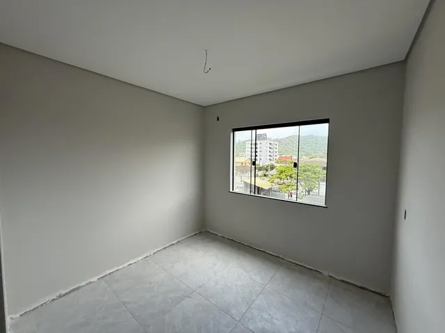 Imagem 3: Apartamento de dois dormitórios, sendo uma suíte, sacada com churrasqueira e uma vaga