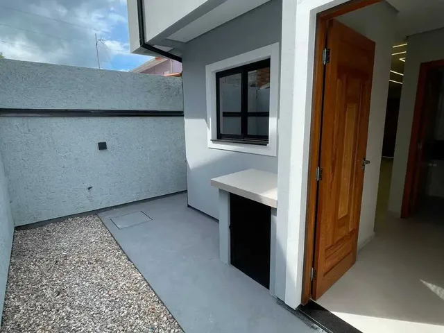Imagem 15: Casa com 2 dormitórios sendo 2 suítes e 2 vagas de garagem em Palhoça/SC