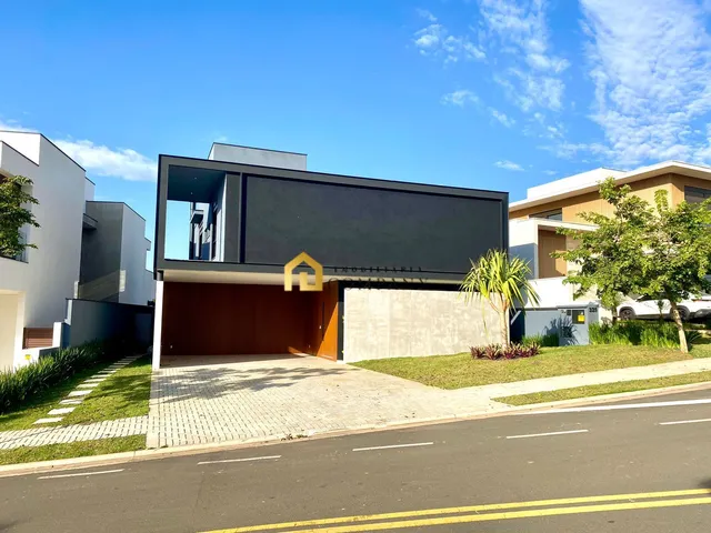 Imagem: A casa em condomínio possui 4 Dormitórios, 4 Suítes, 5