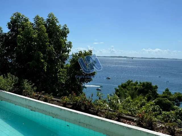Imagem: A casa possui 4 Dormitórios, 4 Suítes, 5 Banheiros, 6 Vagas