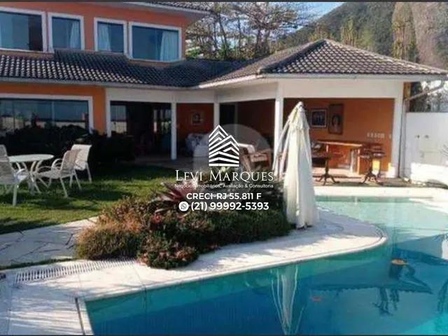 Imagem: A casa possui 6 Dormitórios, 6 Suítes, 5 Vagas na