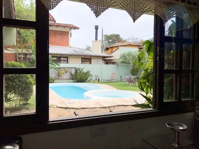 Imagem 10: Excelente casa com piscina e uma ampla área externa na quadra da Praia