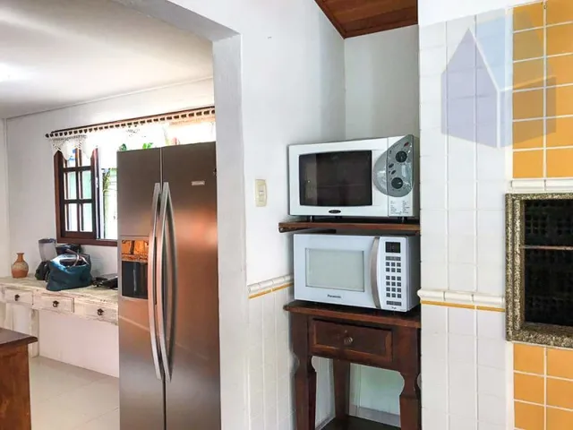 Imagem 7: Excelente casa com piscina e uma ampla área externa na quadra da Praia