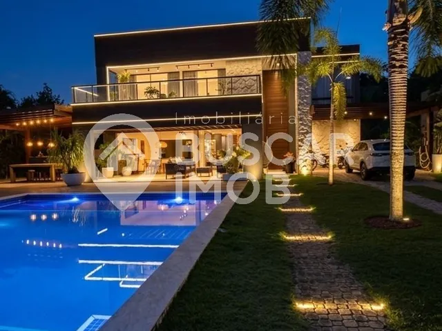 Imagem: A casa em condomínio possui 5 Dormitórios, 5 Suítes, 8