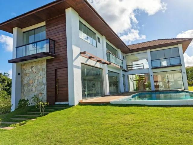Imagem: A casa em condomínio possui 5 Dormitórios, 5 Suítes, 2