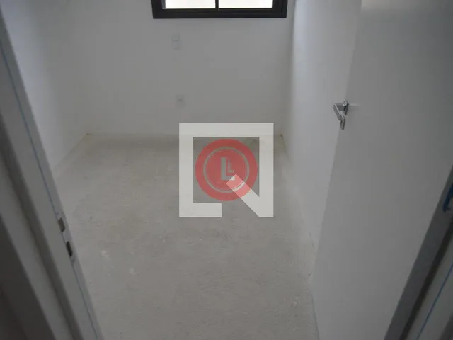 Imagem 9: Este encantador apartamento está localizado na desejada Vila Assunção, em Santo