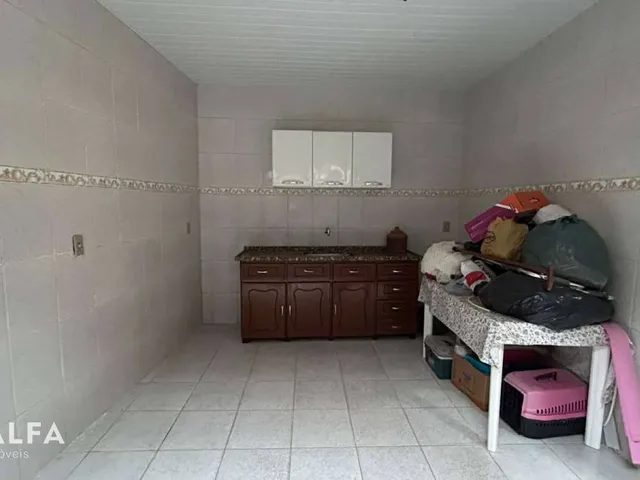 Imagem 9: Casa à Venda no Caminho Novo – Conforto, Espaço e Potencial de Ampliação