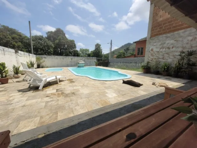 Imagem: Casa com piscina no rio da prata de Campo