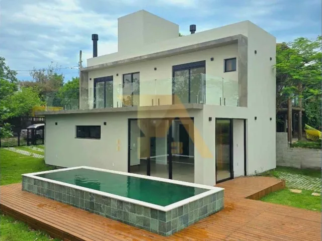 Imagem: Casa Nova com Piscina de Borda Infinita