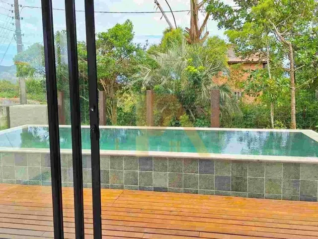 Imagem 2: Casa Nova com Piscina de Borda Infinita e 2 Suítes